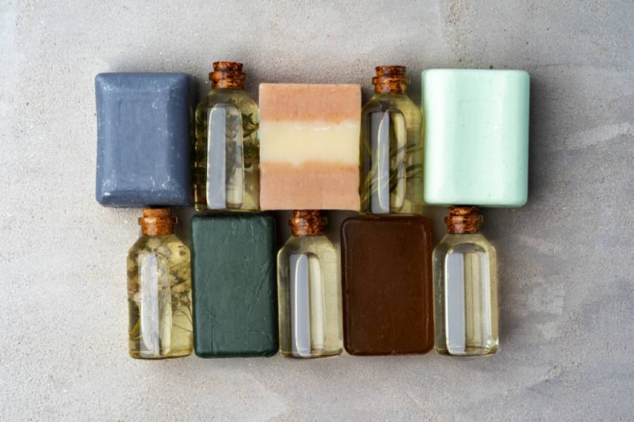 bottles essential oil soap bars gray background 1 1